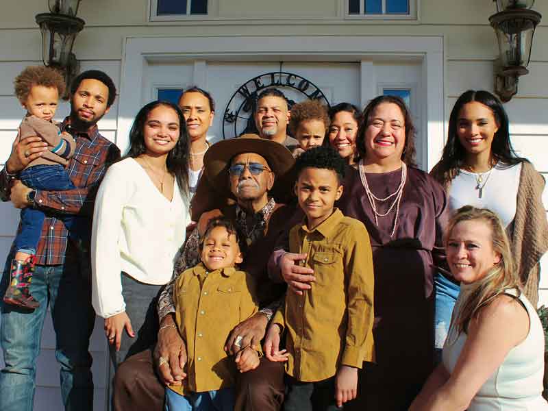 Family taking a family portrait.